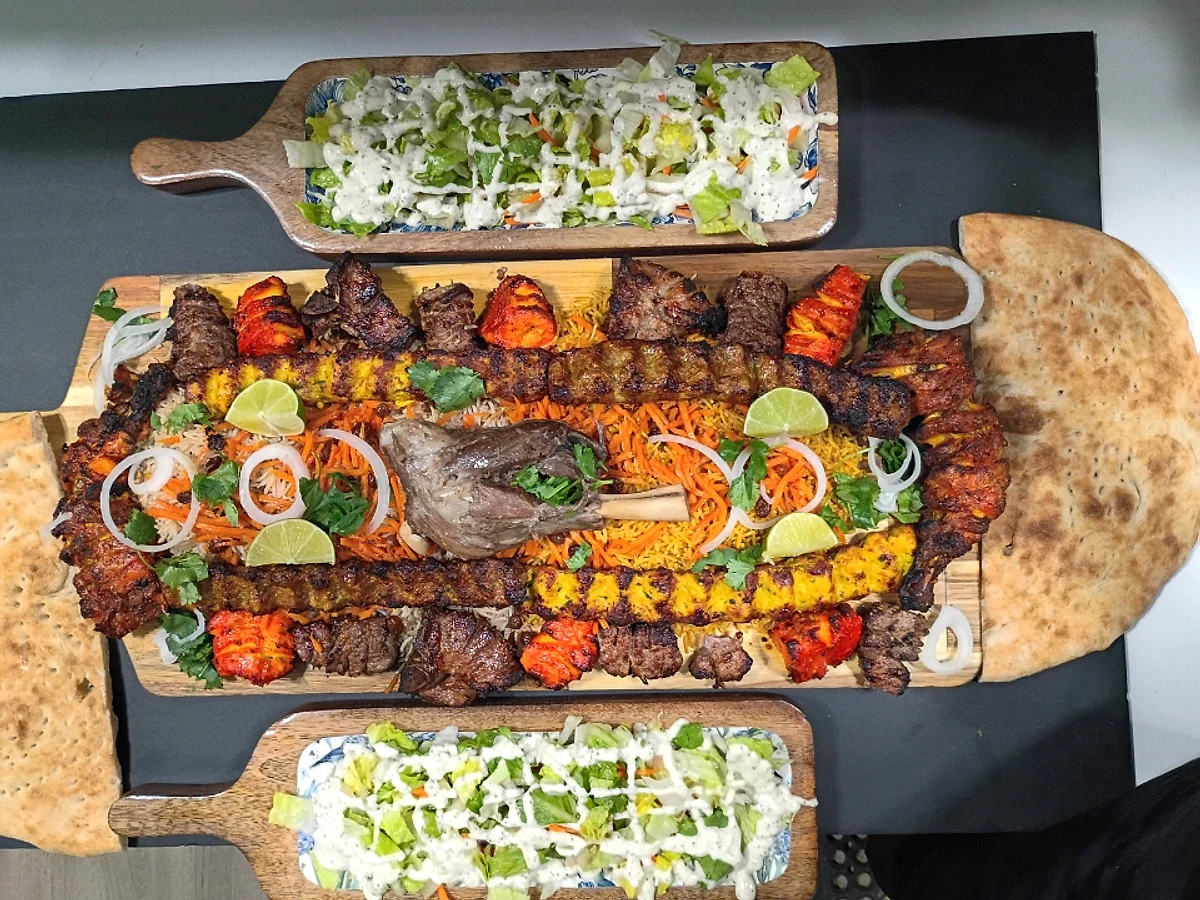 The Afghan Grand Feast mixed grill with rice, bread and salads